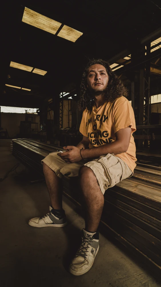 Milkana seated in the warehouse photoshoot